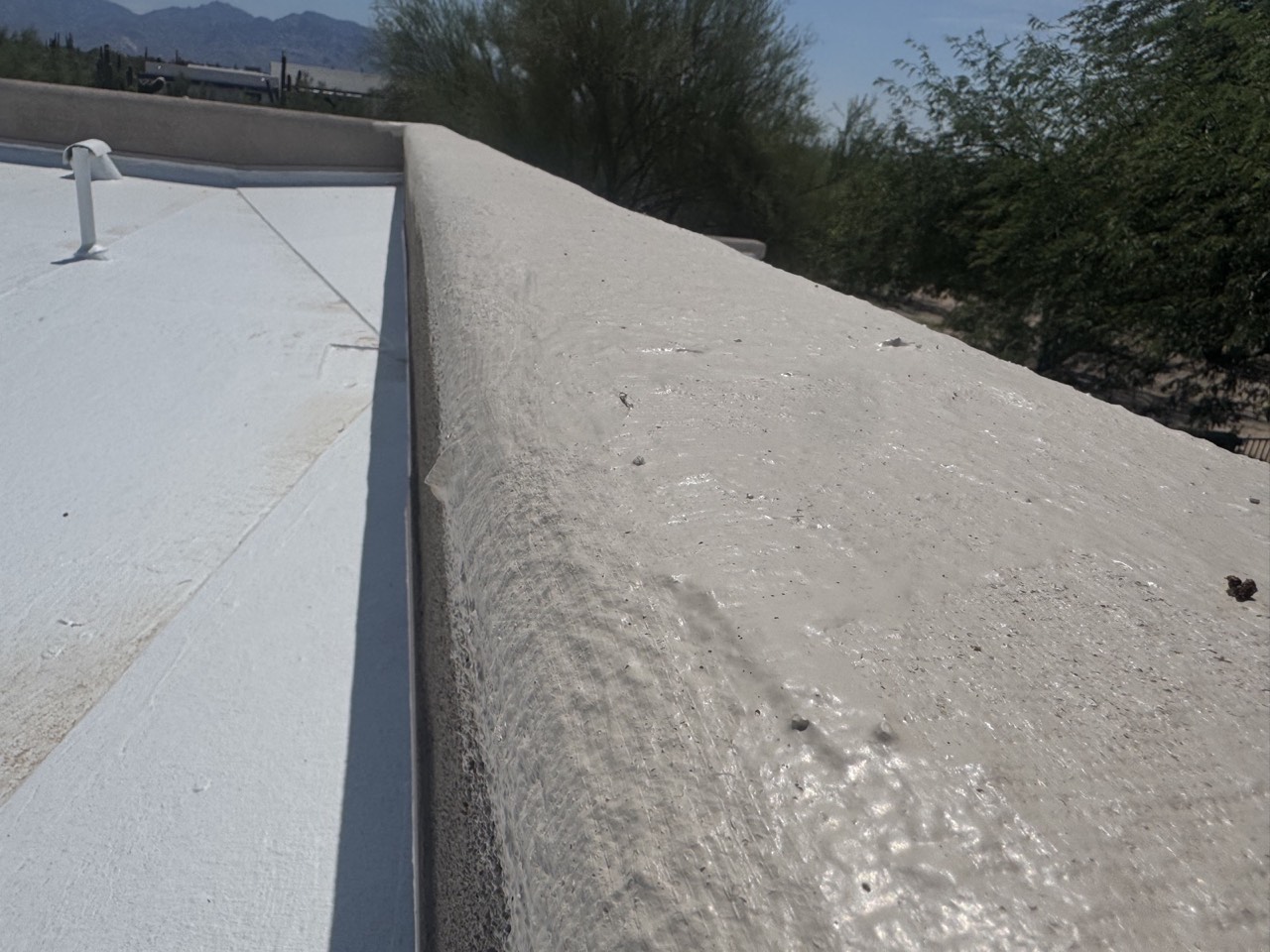 Tan parapet edge, roof coating detail