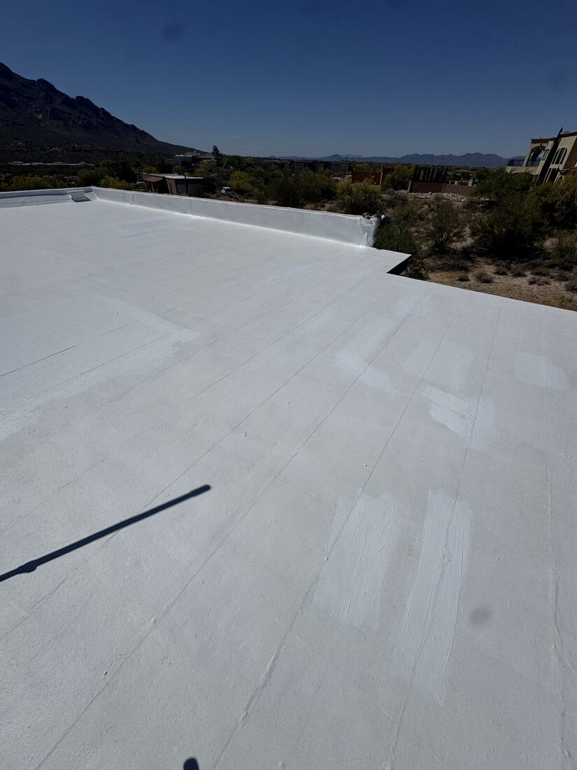 Completed flat roof coating with mountain view